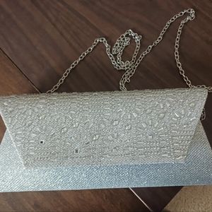 Silver clutch purse with silver chain
